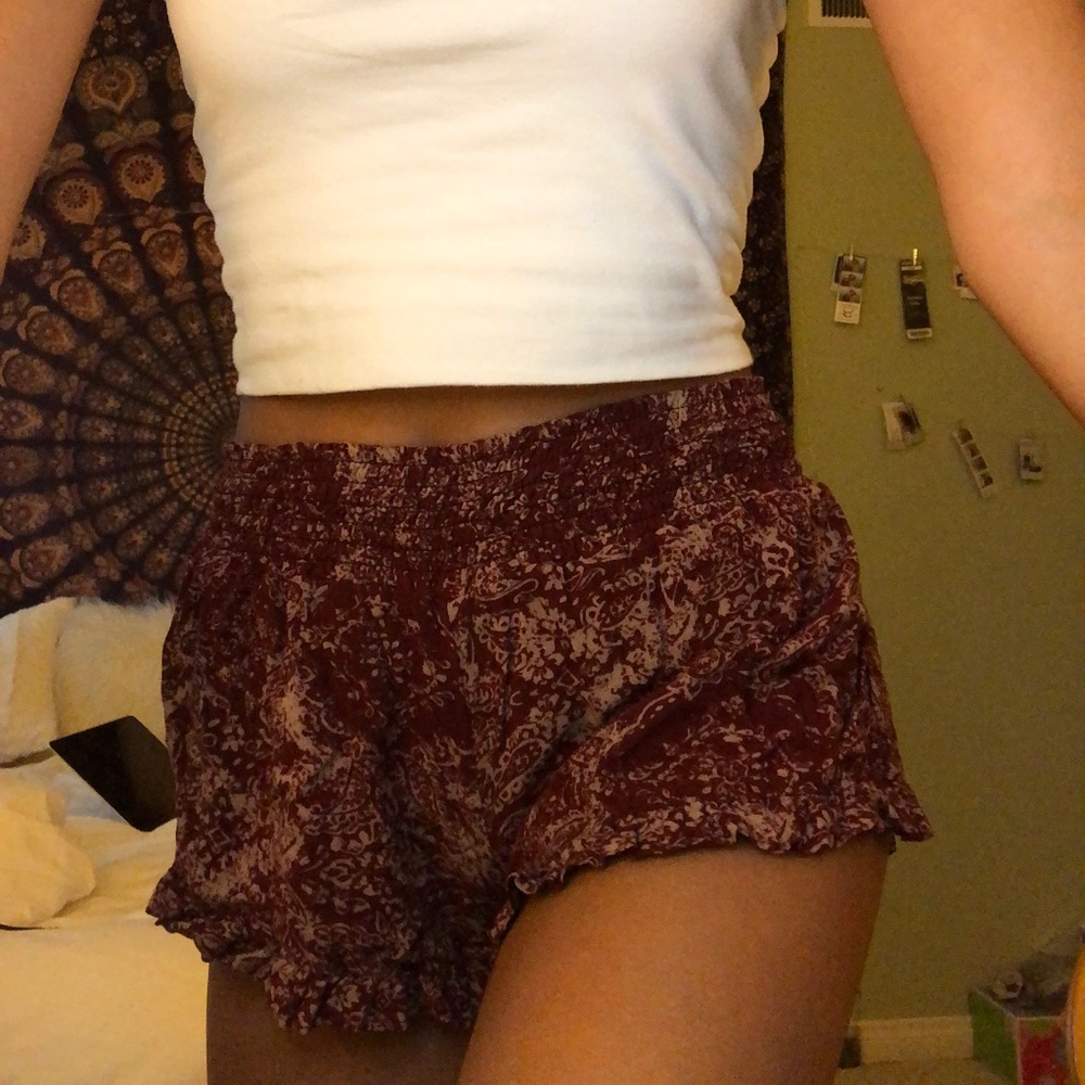 Maroon and tan flowy shorts with design